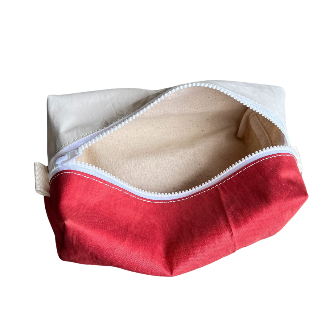 Repurposed sailcloth dopp kit travel bag. Sunfish sail with cute fish logo, red and white design. Unique boat bag eco-friendly upcycled small organizer from small midcoast Maine local business.
