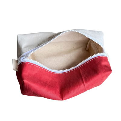 Repurposed sailcloth dopp kit travel bag. Sunfish sail with cute fish logo, red and white design. Unique boat bag eco-friendly upcycled small organizer from small midcoast Maine local business.