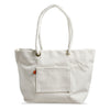 Front view of minimalist, maritime-inspired white canvas tote bag. Brass grommets and thick cotton rope handles, leather details.