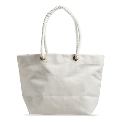 Back view of minimalist, maritime-inspired white canvas tote bag. Brass grommets and thick cotton rope handles, leather details.